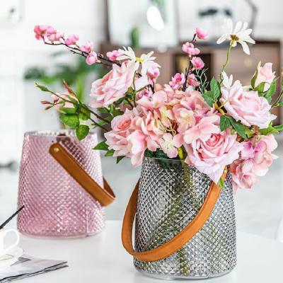 China New Design Minimalist Decor Cylinder Vases Flower Vase Luxury Home Handbag Like Mini Greenhouse Glass Decoration for sale