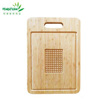 China Large Sustainable Bamboo Meat Cutting Board with Groove and Jus Ruber Feet for sale