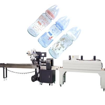 China Food Baby Bottle Heat Shrink Wrapping Machine Thermal Bottle Packing Machine With Automatic Label for sale