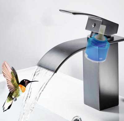 China Modern Black Waterfall Single Handle Basin Faucet Single Hole Bathroom Sink Faucet for sale