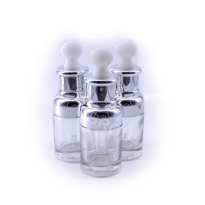 China Personal Care Skin Care Oil Bottle 30ml Empty Perfume Glass Bottle 1oz Glass Essence Bottle With Luxury Silver Dropper Cap for sale