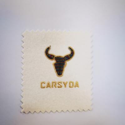 China Fashion And Lovely Oxhead Custom Clothing Patches Electroplating Embroidery for sale