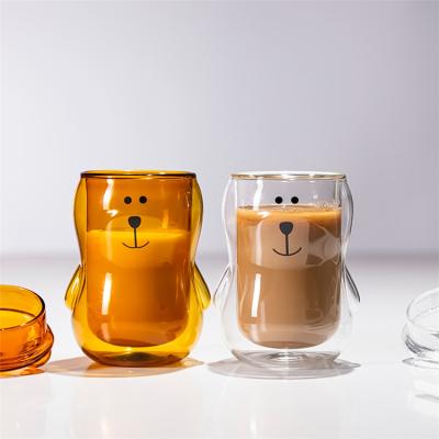 China 300ml Viable Cute Stereo Heart Bear Double Coffee Juice Milk Glass Cup With High Temperature Resistant Lid for sale