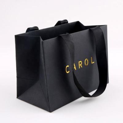 China Recyclable Custom Logo Shopping Tote Bags Black Paper Gift Bags Retail Store Bags For Shoes And Clothing for sale