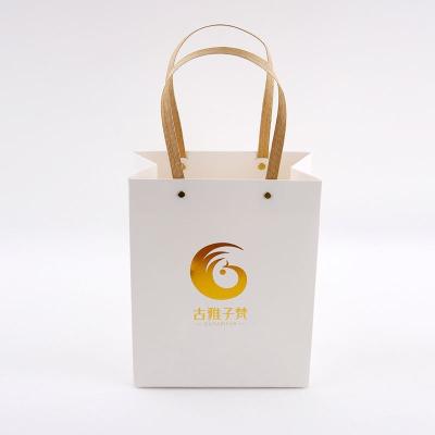 China Recyclable luxury boutique retail shopping gift packaging custom printed small black paper bag with your own logo for sale