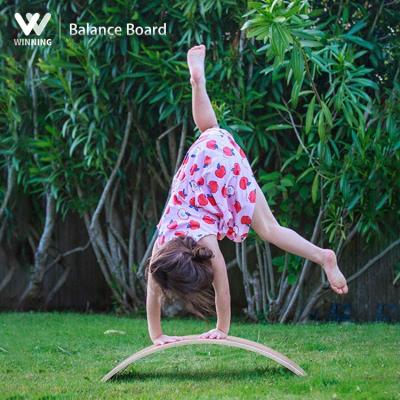 China Complete Fitness Exercise Winning New Design Montessori Balancing Wooden Toy Wobble Curved Board Game Kids Yoga Fitness For Children Balance Wood Board for sale