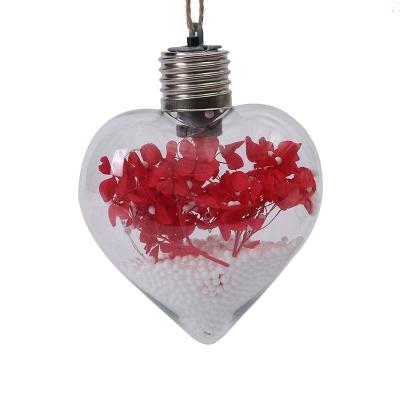 China 2022 Heart Shaped Xmas Ball Christmas Decoration Tree Christamas Ball LED Light Outdoor Transparent Ball for sale