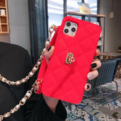 China Drop Protection Case Mobile Phone Accessories Phone Cover Device Handbag Shockproof Case With Pearl Elegant Long Cross Body Chain Case For Women for sale