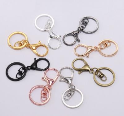 China Souvenir Gifts Promotion Hot Sale Customizable DIY Quality And Creativity Alloy Key Chain Lobster Buckle Set Gold Bag Doll Key Chain Pendant Accessories for sale