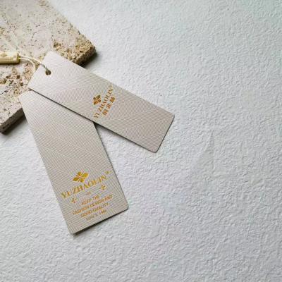 China Sustainable Personalized Embossed Hang Tags Custom Printed Gold And Text Price Tag For Clothes , Jewelry for sale