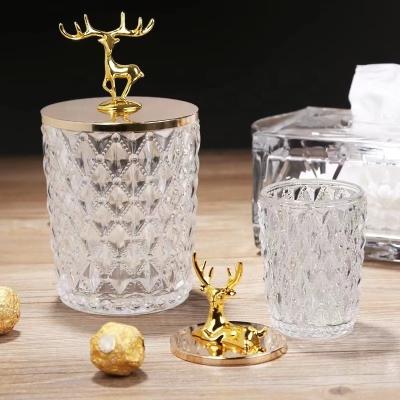 China Art Deco Simple European style gold deer decoration main storage jar embossed crystal glass cotton pick toothpick jar candy jar en venta