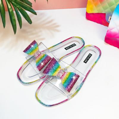 China New Design Fashion Trend Sales Rivet Jelly Casual Slippers Hot Rhinestone Flat Sandals Raining Bowknot Fashion Slides Bow Color for sale