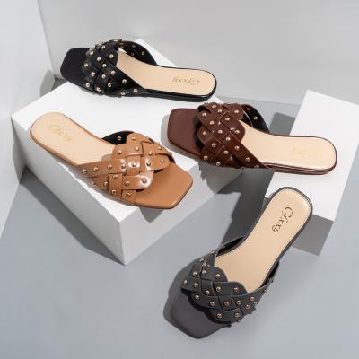 China Women's Flat Heeled Braided Version Rivets Fashion Open Toe Outside Casual Flat Bottom For Women Slippers for sale