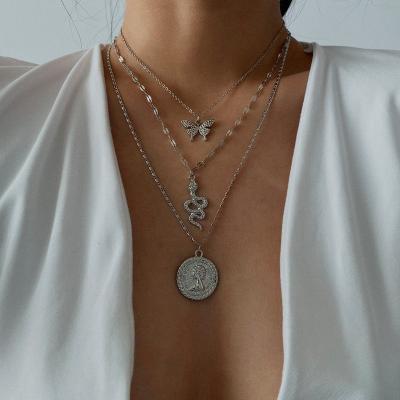 China Chic Vintage Punk Snake Coin Head Butterfly Necklace For Women Clavicle Chain Queen Head Pendant Long Refined Elegant Gift for sale