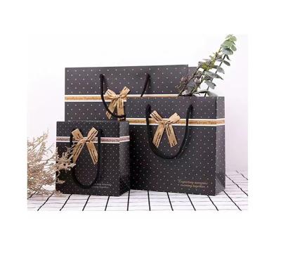 China Recycled Materials Custom Print Your Own Logo Environmental Friendly Paper Bag Packaging With Black Ribbon Handling for sale