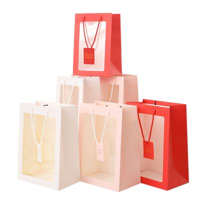 China Recyclable Paper Bag Gift Bag Paper Gift Bags Transparent Window Gift for sale