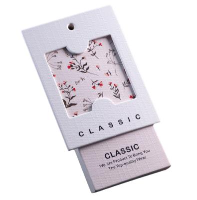 China Recyled Garment Hanger Tags Wholesale Design Paper Custom Printed Logo Paper Hang Clothing Tags for sale