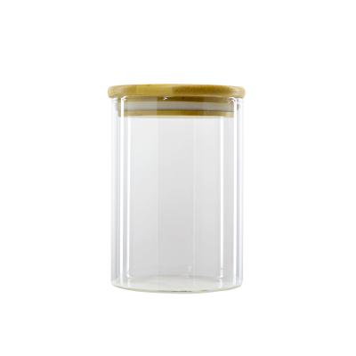 China Sustainable Clear Glass Storage Food Jar With Bamboo Lids High Borosilicate Glass Bottle for sale