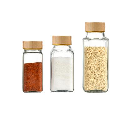 China 120ml 4oz Eco-friendly Recyclable Empty Square Spice Jar Glass Containers With Lids And Airtight Wood Shaker Caps for sale