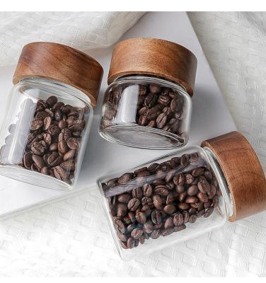 China 200ml 300ml 400ml 500ml Cylinder Food Container Glass Coffee Heatable Transparent Jars With Acacia Wood Lid for sale