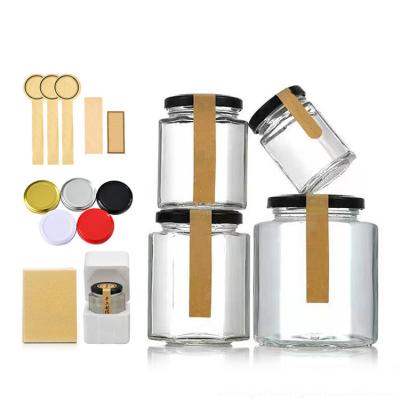 China Food Wholesale 100mL 500mL Empty Square Hexagon Glass Honey Jars With Screw Metal Black Gold Cap for sale