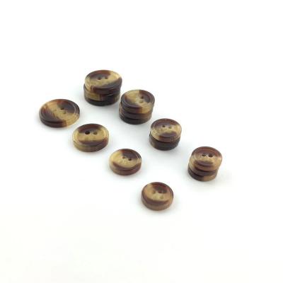 China Imitation Polyester Fancy Material Dry Cleaning Design 4 Holes Horn Design Resin Rod Button For Shirt /Coat for sale