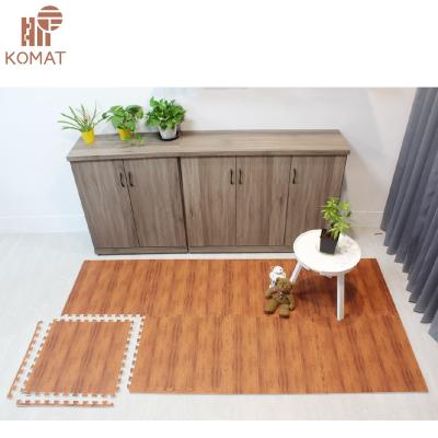 China Waterproof Pitch Pine Look EVA Foam Wooden Grain Floor Tile Mat for sale