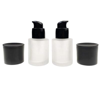 China 30ML 1oz Cosmetic Empty Clear Frosted Glass Pump Bottles With Black Pump Head Foundation Liquid Container for sale