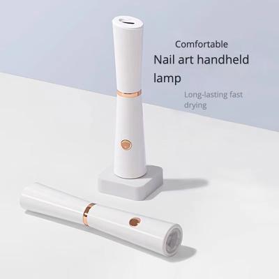 China Nail Art Salon+home Handheld manicure in-line lamps small portable power storage mini UV lamp non-black hands quick-drying nail tip heating lamp for sale