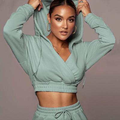 China Breathable Sexy Solid Crop Cross New Arrival Hoodies Women Deep-neck Top Pants Set Loose Jogger Hoodie Set for sale