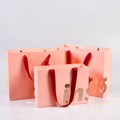 China Recyclable Personalized Custom Logo Print Rose Gold Hot Stamping Luxury Clothing Package Shoes Store Paper Bag for sale