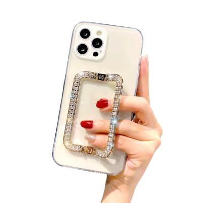 China With Luxury Diamond Metal Wrist Stand Transparent Phone Case For Pro 12 Mini XR Max Cell Phone Ip13 Clear Space Shell for sale