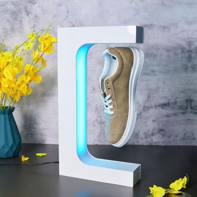 China Shoe Light Top End Creative Men's Casual Magnetic Levitation Floating Led Lighting Hoe Display Stand Shoes Rack for sale