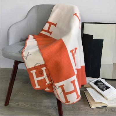 China Plain Morden Style Brand H Blanket High Comfort Wool Knitted Camping Blanket For Drop Shipping On Stock Orange Color for sale