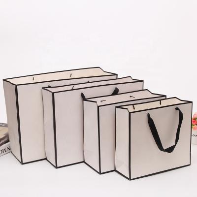 China Recyclable Low Price Guaranteed Recyclable White Paper Offset Printing Quality Fast Food Bag Paper Bags Clothing Packaging for sale