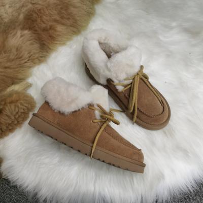 China Factory direct wholesale winter sheepskin fur warm boots round waterproof furry snow boots for women for sale