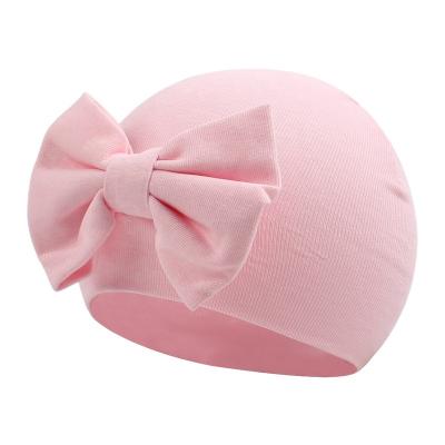 China Soft Warm Cozy Colorful Organic Infant Beanie Newborn Bow Hat Plain Winter Hospital Baby Hat 100% Cotton For Infant Girl Fall for sale