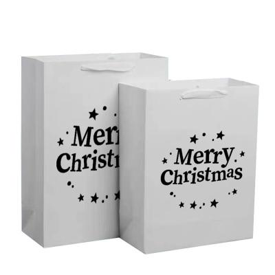 China Recyclable Kraft Paper Tote Bag Hot Foil / UV / Varnish Christmas Gift Wrap Bags for sale