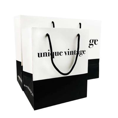 China OEM Customized Designs Luxury Matte Gift Shopping Paper Bag With Logo For Clothing Shoes for sale