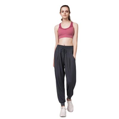 China Breathable Quick Dry Loose Fit Casual Solid Color Fitness Sweatpants Yoga Pants High Pocket Slim Legged Running Waist for sale