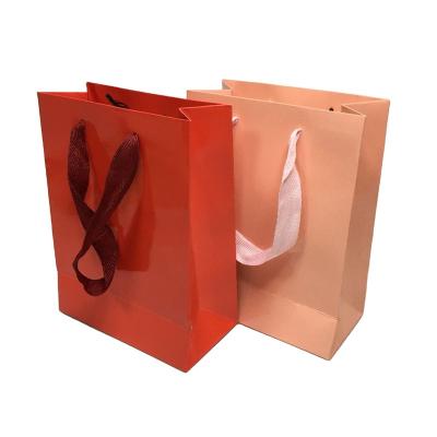 China Recycled Luxury Black Custom Printed Paper Bag Logo Jewelry Packaging Kraft Shopping Materials Gift Paper Bag With Ribbon Handles for sale