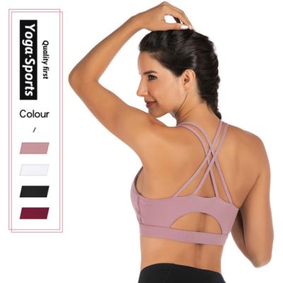 China High Print Solid Color Sports Bra Cross Back Strappy Breathable Yoga Bra Sports Bra With Removable Cups for sale