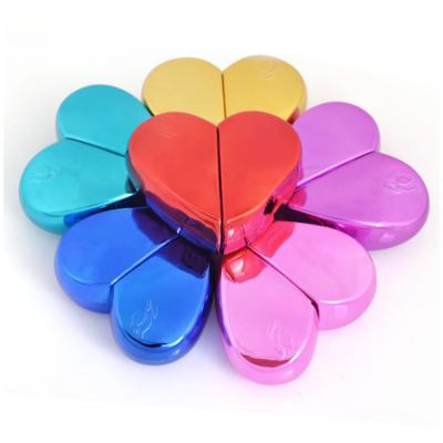 China 25ml Cosmetic UV Plating Portable Heart Shaped Colorful Empty Glass Women Perfume Spray Bottle for sale