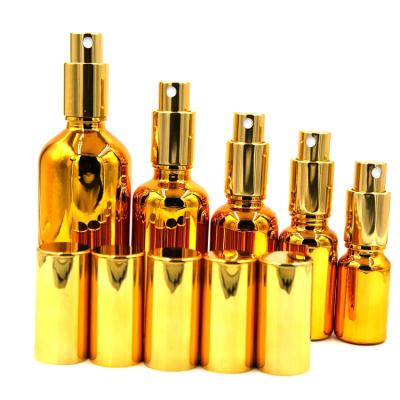 China Personal Care 10ml15ml30ml50ml100ml Round Shape Essential Oil Bottle Perfume Spray Gold Plated Glass Bottle for sale