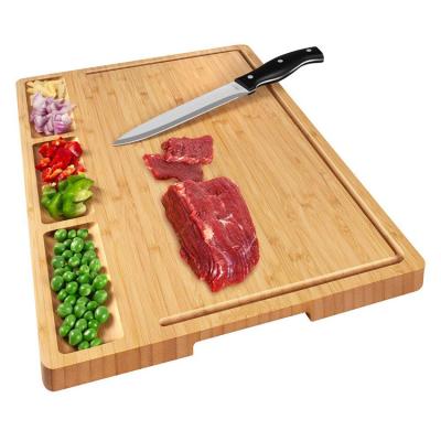 China Large Sustainable Kitchen Utensils Bamboo Wooden Cutting Board With Juice Slot for sale