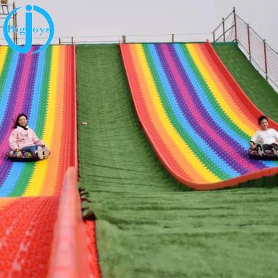 China Amusement Plastic Outdoor Rainbow Dry Playground Slide For Amusement Park Use for sale