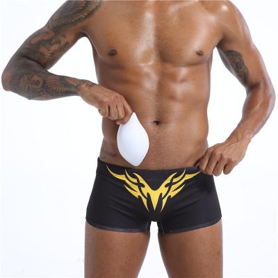 China Swim Angle Rise Low Waist Anti Embarrassment Men's Swimming Trunks Sexy Flat Detachable Cup Plus Trunks for sale