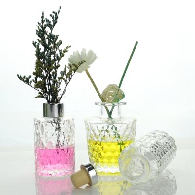 China Eco-Friendly Custom Unique Design Round Glass Diffuser Bottle with Rubber Stopper for Home Decor for sale