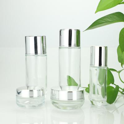 China Custom Made Clear Glass Cosmetic Empty Lotion Bottles 100ml 40ml Cream Jars 50g 30g Eco - Friendly for sale