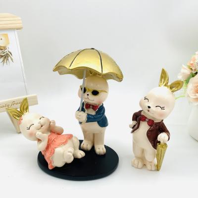 China China Cute Cartoon Resin Rabbit A Crafts Home Furnishings Resin Rabbit Couple Umbrellas Three Gift Set for sale